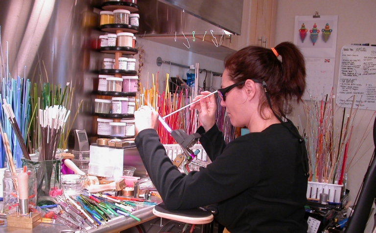 Lori Greenberg making glass beads at torch 2016