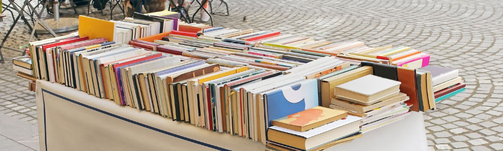 image of table full of used books for sale